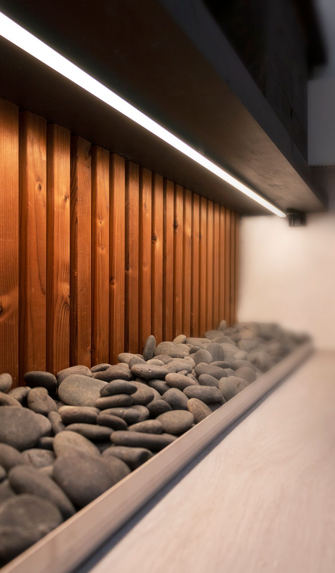 Bathroom stone accent with LED strip attached to the bottom of the level. Ledstore.fi
